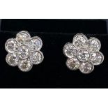 A pair of 18ct white gold diamond set cluster earrings, approx. 2ct overall.