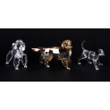 Three boxed Swarovski crystal figures of dogs, tallest H. 6cm.