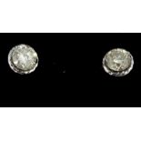 A pair of boxed 18ct white gold diamond set stud earrings, approx. 0.40ct.