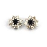 A pair of 9ct yellow gold sapphire and diamond set cluster earrings, Dia. 0.9cm.
