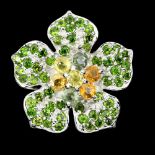 A 925 silver flower shaped ring set with chrome diopside and yellow sapphires, Dia. 2.8cm, (N).
