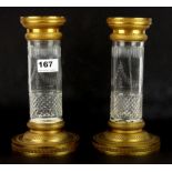 A pair of 19th Century gilt bronze and cut crystal candle sticks, H. 23cm.