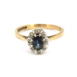 A 9ct yellow and white gold sapphire and diamond set cluster ring, (Q).