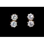 A pair of 9ct yellow gold stone set stud earrings, L. 0.5cm.
