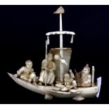 A 19th/ early 20th Century Chinese carved ivory group of figures in a boat, H. 13cm.