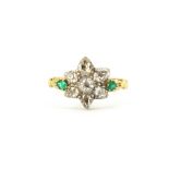 An antique yellow metal (tested high carat gold) flower shaped cluster ring set with old pear cut