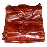 An impressive fully fitted Club Exclusive leather suit carrier, size 56 x 56cm.