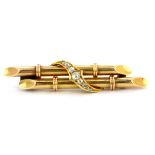 A 15ct yellow gold (stamped 15ct) bar brooch set with old cut graduated diamonds, L. 5cm.