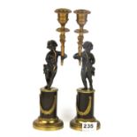 A pair of 19th Century French gilt bronze cherub candlesticks, H. 29cm.