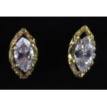 A pair of 18ct yellow gold (stamped 750) stud earrings set with marquise cut diamonds, L. 0.9cm.