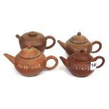 A group of four Chinese Yixing terracotta teapots, H. 8cm.