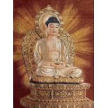 A Tibetan woven silk and gilt thread panel of the seated Buddha, 90 x 61cm.