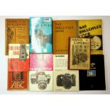 A quantity of vintage camera manuals.