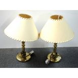 A pair of gilt brass table lamps.