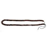 A single strand of Tibetan human skull prayer beads, bead 1cm, folded L. 38cm.