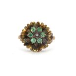 A 9ct yellow gold cluster ring set with emeralds and a diamond, Dia. 1.5cm, (N.5).