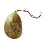 A Chinese carved mixed colour jade / hardstone tiger amulet, L. 5cm.