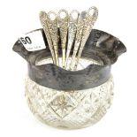 A hallmarked silver mounted cut glass bowl and six hallmarked silver tea spoons.