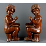 A pair of carved wooden cherub figures, H. 42cm.