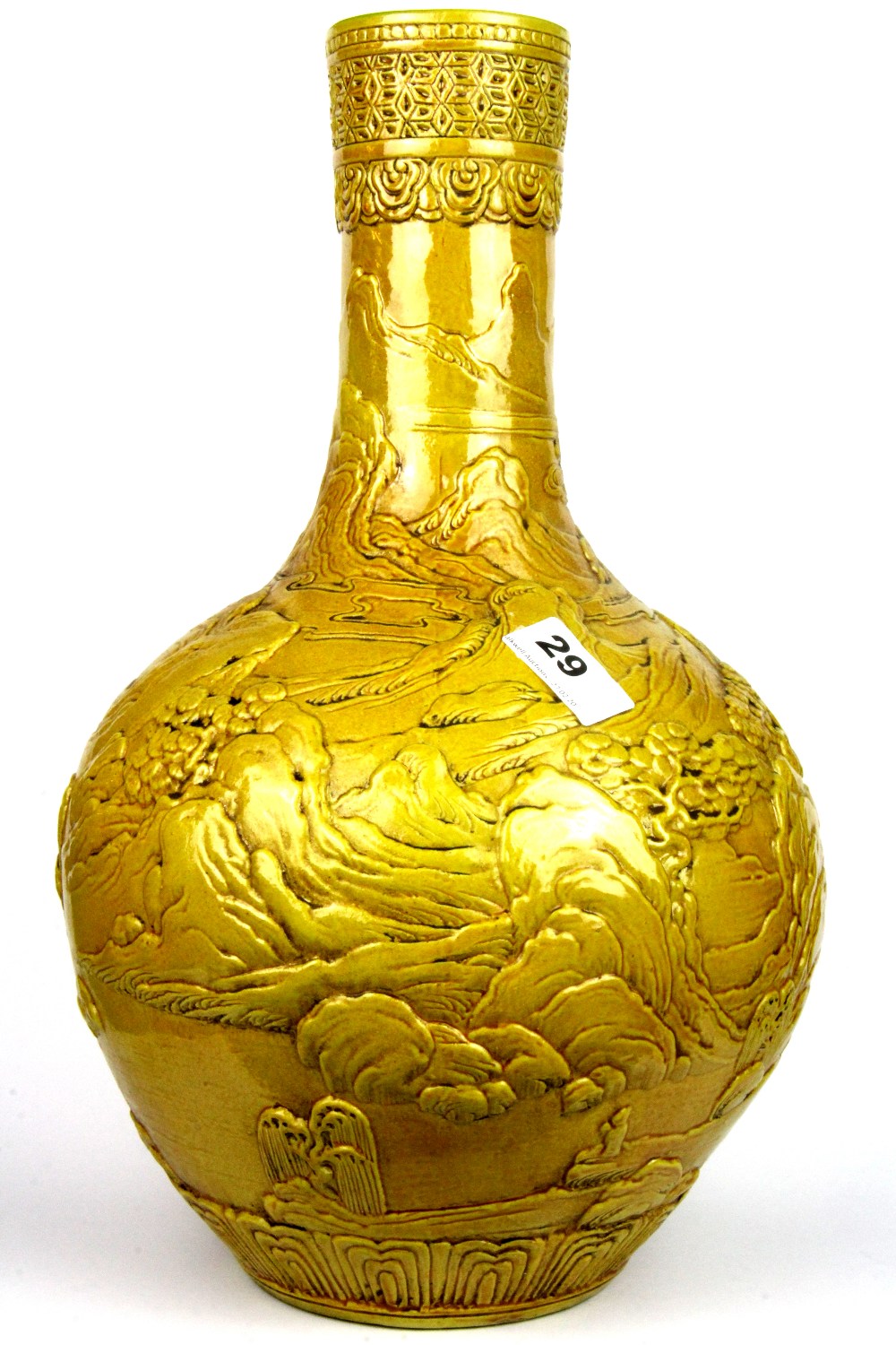 A Chinese relief decorated Imperial yellow glazed porcelain vase, H. 39cm.