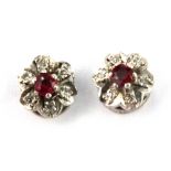 A pair of 9ct yellow gold ruby and diamond set cluster earrings, Dia. 0.58cm.