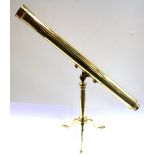 A large brass telescope and stand, closed telescope L. 83cm.