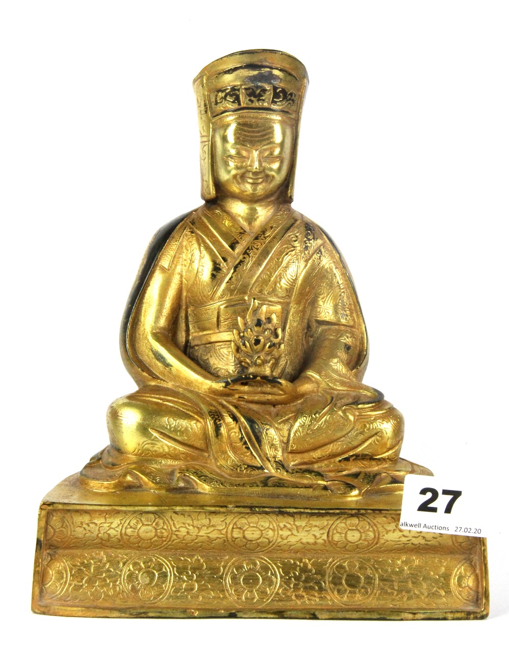 A Tibetan gilt bronze figure of a seated Lama, H. 20cm.