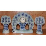 A French Art Deco porcelain clock set, H. 20.5cm.