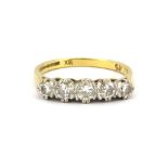 An 18ct yellow and white gold ring set with five brilliant cut graduated diamonds, (O.5).