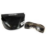 A boxed pair of Chanel sunglasses.