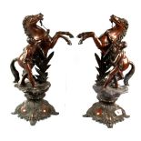 A pair of 19th Century French bronzed spelter Marley horse figures, H. 40cm.