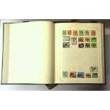 Four stamp albums and a First Day cover album.