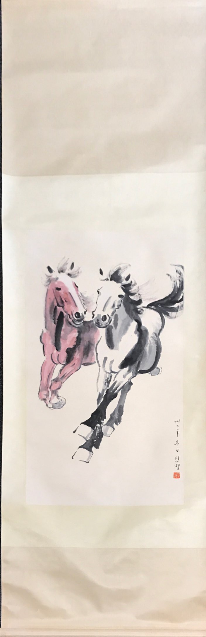 A Chinese silk mounted scroll painting of two horses, W. 63cm, L. 205cm.