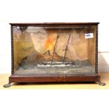 A mahogany cased musical automaton of a sailing ship passing Mount Vesuvius, mounted on lions paw