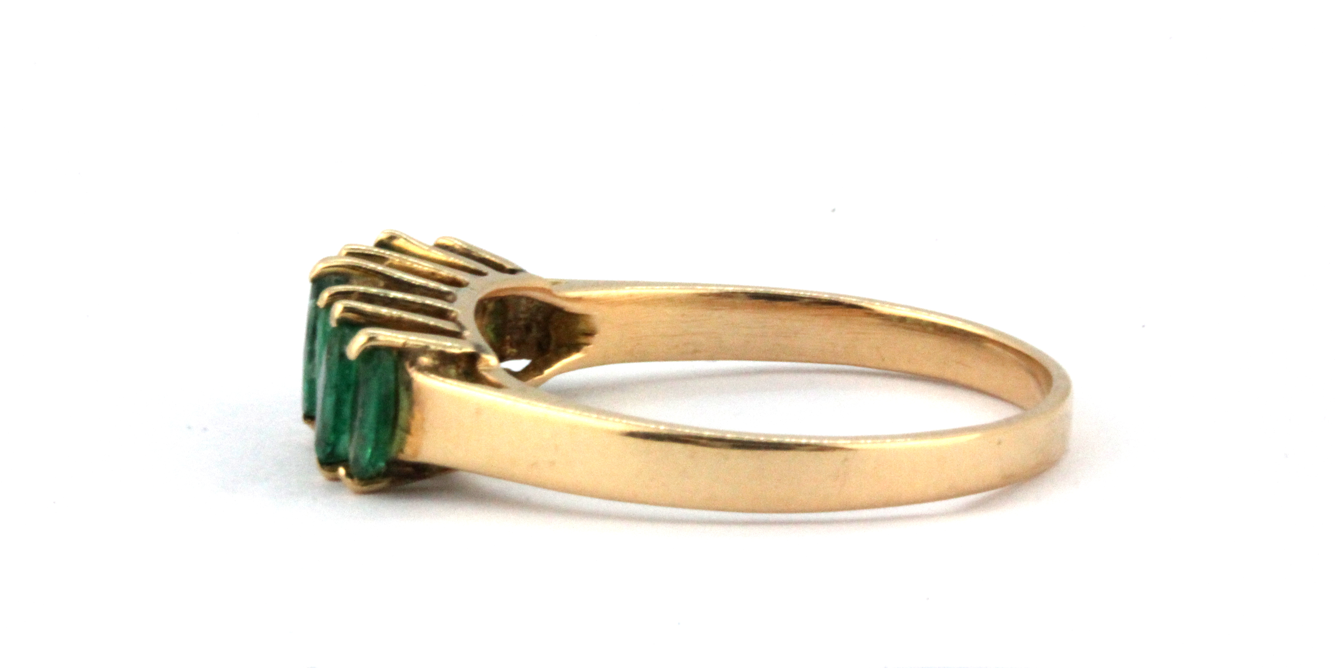 A yellow metal (tested minimum 9ct gold) ring set with marquise cut emeralds, (R). - Image 2 of 2