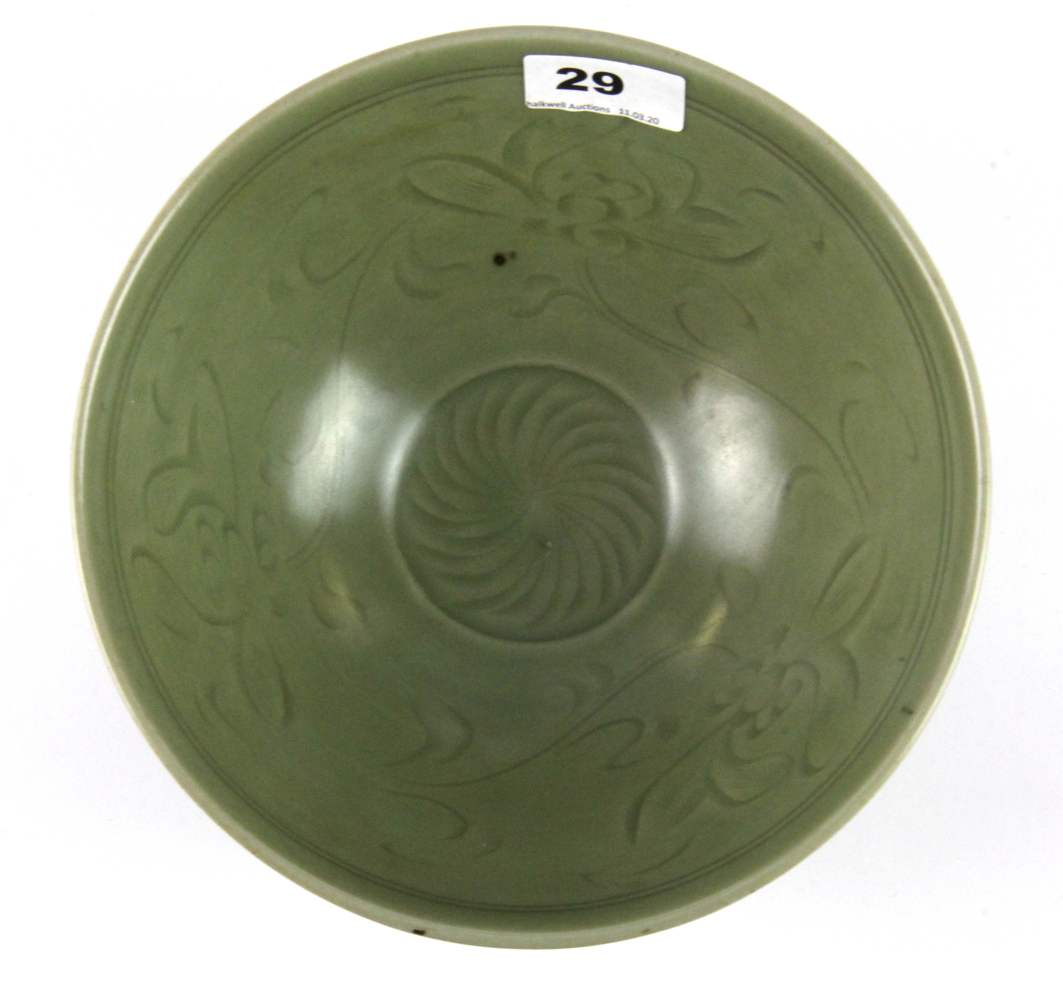 A Chinese incised celadon glazed porcelain bowl, Dia. 21cm, H. 9cm.