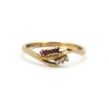A 9ct yellow gold ruby and diamond set ring, (S).