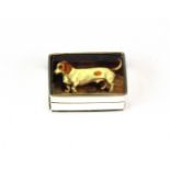 A sterling silver and enamel pill box with an image of a dachshund, 3 x 2.5 x 1.2cm.