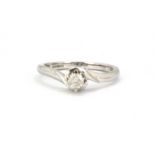 A 9ct white gold diamond set solitaire ring, (J).