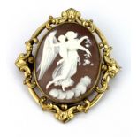 A yellow metal mounted carved cameo brooch, L. 6.5 x 6cm.