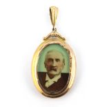 A 9ct yellow gold double portrait locket pendant, L. 4.5cm.