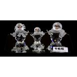 Three Swarovski silver crystal snowman figures with mirror, tallest H. 6cm, all boxed.