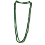 A long single strand necklace of 6mm polished jade beads, necklace L. 210cm.