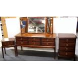 A stag mahogany dressing table, chest of drawers and bedside cabinet, dressing table W. 130cm.