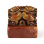 A Chinese carved stone scholars seal mounted with two dragon heads, 5 x 5 x 5.5cm.