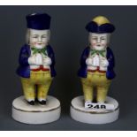 An early 19th century porcelain Toby character pepper and vinegar bottle, H. 15cm.