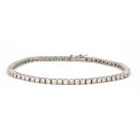 An 18ct white gold (stamped 18ct) tennis bracelet set with brilliant cut diamonds, approx. 3ct, L.