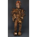 A superb African Nkondi tribal double headed carved wooden protection figure with nails hammered