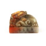 A Chinese carved mid 20th century soapstone scholars seal mounted with a dragon, 5 x 4 x 4cm.