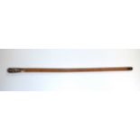 A Siamese 19th century hammered white metal handled walking stick, handle L. 8.5cm.